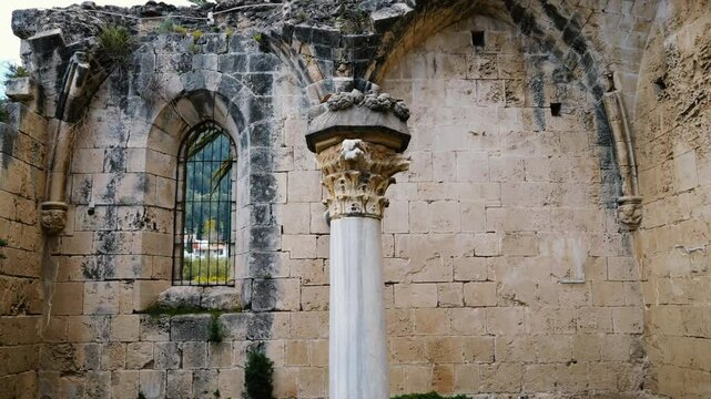 Slow motion panning video of an ancient column located in Bellapais, North Cyprus.