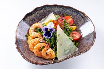 Salad with Shrimp, Greens, Tomatoes, Arugula, and Cheese on a White Plate