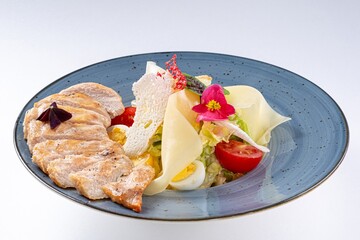 Juicy Pan-Asian Salad with Chicken Breast, Vegetables, Parmesan, and Flower Garnish