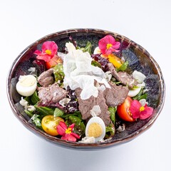 Hot Pan-Asian Salad with Meat, Egg, Greens, and Flower Garnish