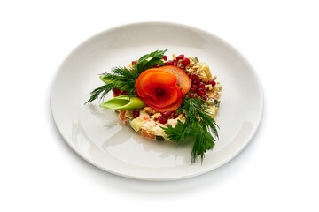 A plate of food with a garnish of parsley and a carrot on top