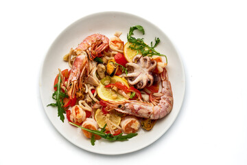 A plate of food with shrimp, tomatoes, and an octopus