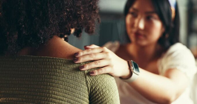 Woman, empathy and hand on friends shoulder for comfort with depression, grief and compassion on sofa. Support, people and sympathy for bereavement, console and mourning with mental health in home