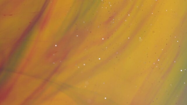 Abstract background. Colored streaks create structures under the influence of water.