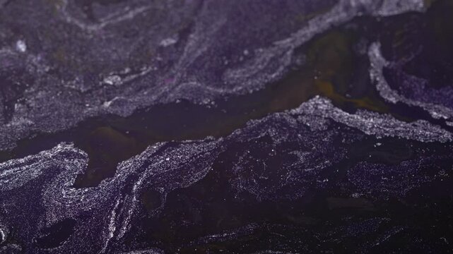 Flow of glitter liquid with dark navy shade.Abstract background