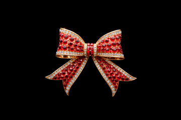 Fototapeta premium A brooch in the shape of a bow on a black background