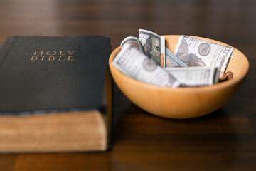 Idea of giving tithe as an offering to charity filled him with hope and peace, as he donated money with faith in making positive impact. book, financial, believe, spiritual, currency, wealth, coin