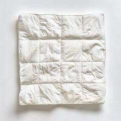 Obraz premium Folded white quilt on white background.