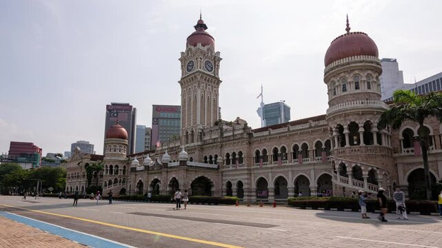 Kuala Lumpur, Malaysia, August 31, 2024: Time Lapse of Clock Tower of Sultan Abdul Samad Building at Merdeka Square. The popular places for tourism.