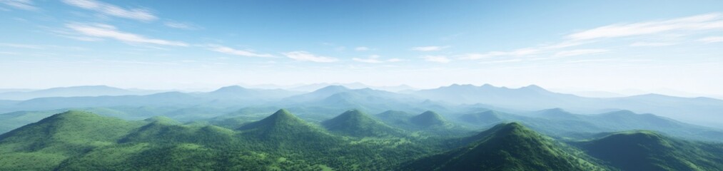 Fototapeta premium A panoramic view of lush green mountains under a clear blue sky.