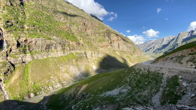 Beautiful himalayan mountain landscape in the evening with waterfall and chenab river at bashisht, gramphu-batal-kaza road lahaul himachal pradesh, India.