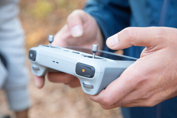 Caucasian man using drone controller.