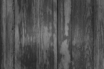 The photo shows the texture of old gray wooden boards