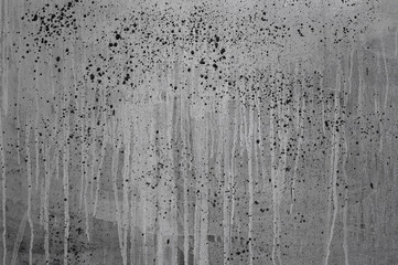 gray background, on a gray wall with streaks, splashes and strokes of paint