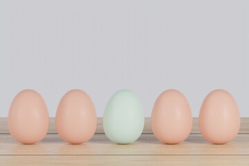Neatly lined up eggs with one egg that stands out