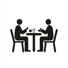 Two people sitting at a table having a meal.