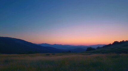 Brilliant sunset colors blend seamlessly with a clear blue evening sky, creating a stunning panoramic view
