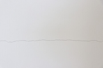 Small cracks on the white wall
