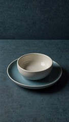 White ceramic serving dish on blue background.