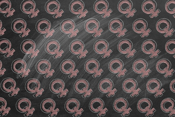 Background from hand drawing women gender icons on blackboard