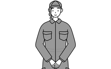 Fototapeta premium 体の前で手を重ねるつなぎ姿の女性整備士