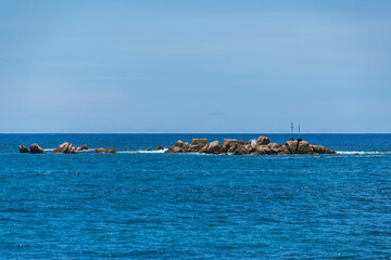 Fototapeta premium Beacon On A Rocky Islet