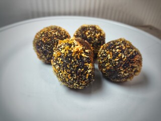 Selective image of melted chocolate purple sweet potato, homemade home food dish. served on a plate.