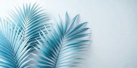 Fototapeta premium Tropical Palm Leaf Arrangement on a Light Blue Background