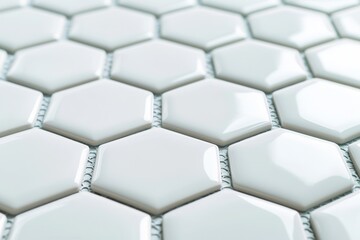 Material science and strength, A close-up view of glossy white hexagonal tiles creating a modern and stylish pattern on a surface.