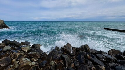 The video captures the raw power of a stormy sea, where dark, turbulent waves crash forcefully...