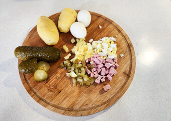 chopped Olivier salad, eggs, potatoes, cucumber, sausage.