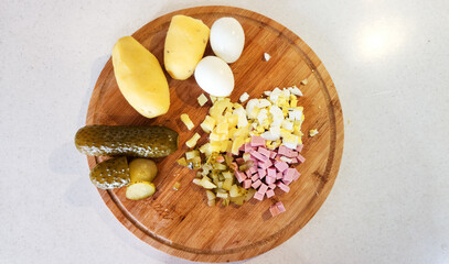 chopped Olivier salad, eggs, potatoes, cucumber, sausage.