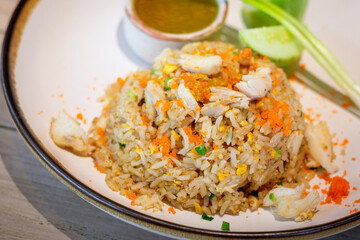 Close up shot of fried rice with crab paste, shrimp eggs, spring onion and seafood sauce