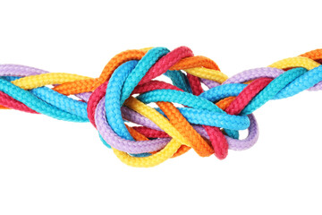 Colorful ropes tied in knot isolated on white. Unity concept