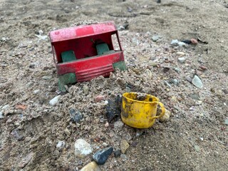 beach old children's plastic toys on the shore Children's toys are rubbish on the beach