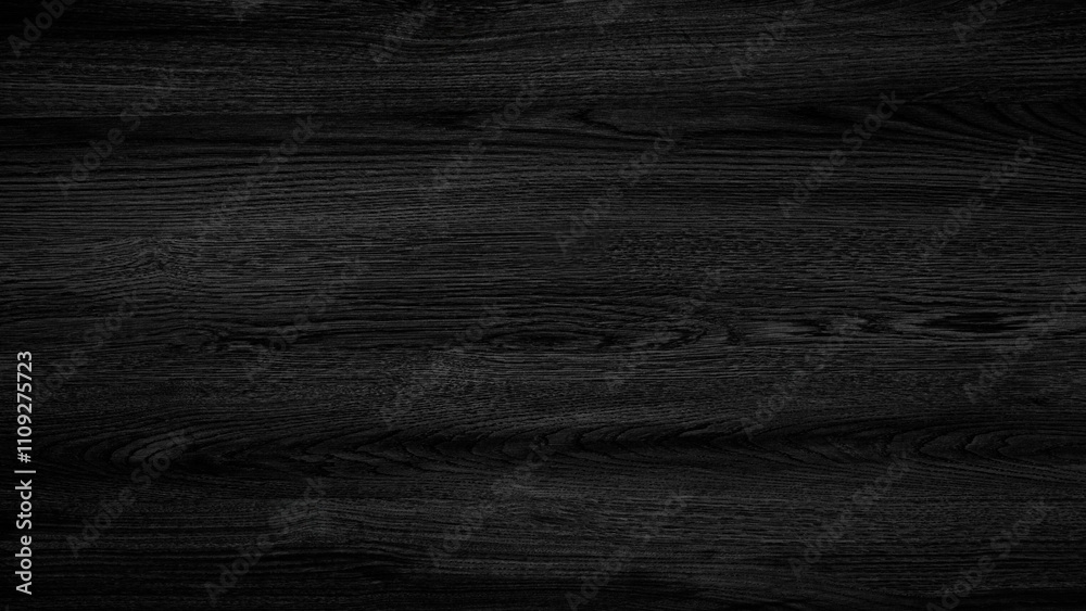 Aufkleber a black wooden surface with a grain pattern. the surface is dark and has a natural texture. the wood
