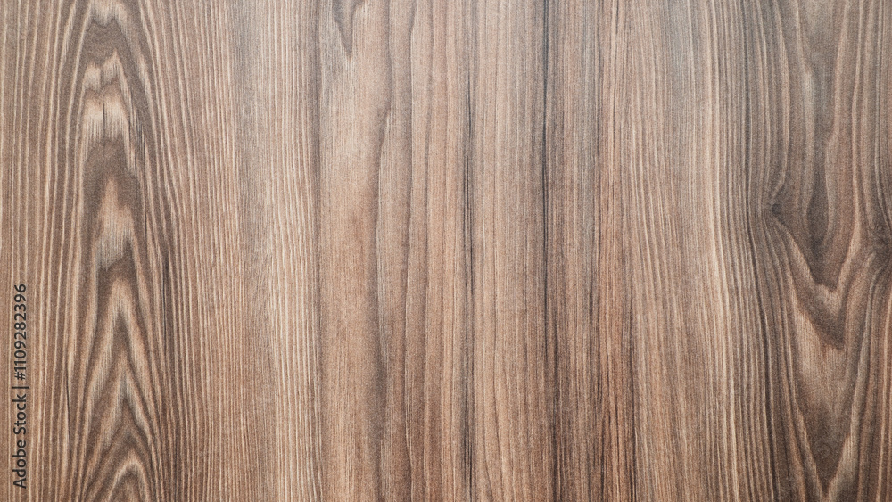 Aufkleber A wooden surface with a grain pattern. The wood is brown and has a natural texture. The surface is smooth and has no visible blemishes
