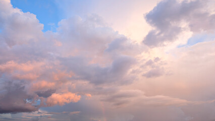 A beautiful sky with pink clouds. The sky is very clear and the clouds are very fluffy