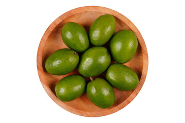 Fresh kedondong or ambarella fruit on a wooden plate isolated transparent