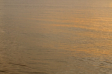 Waves of the sea with sunlight shining down