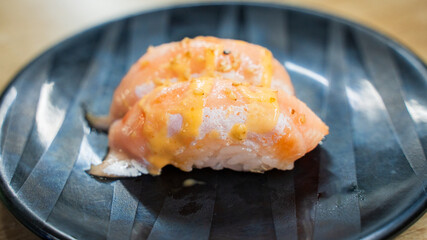Salmon sushi with miso sauce. The fish is topped with miso, sesame seed. It is fresh, juicy, sweet....