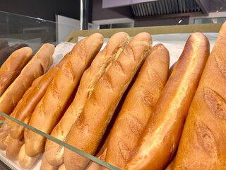 fresh baked goods buns loaf rolls in wicker baskets in the store at the market on sale