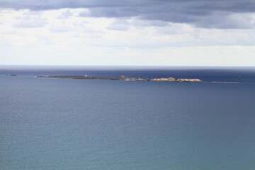 Fototapeta premium Scenic view of Tabarka Island from a lookout near Santa Pola lighthouse in Spain