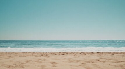 Obraz premium Minimalist summer beach background with soft sand, a calm ocean, and plenty of space for mockups or text