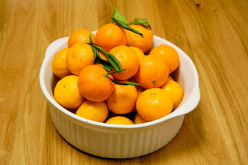 Beautiful, healthy mandarins in a ceramic bowl
