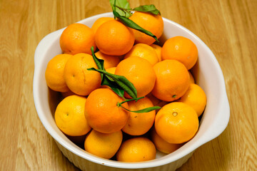 Beautiful, healthy mandarins in a ceramic bowl