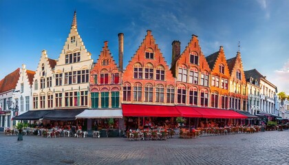 restaurants on bruges markt market square colorful houses with crow stepped gables in bruges belgium