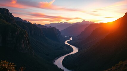 Fototapeta premium Serene River Winding Through Majestic Mountain Range As Sunset Bathes The Landscape In Golden Hues