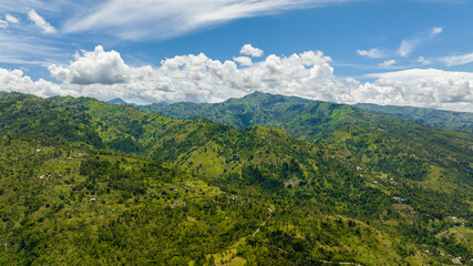 Obraz premium Aerial drone of mountain range with green tropical vegetation. Negros, Philippines