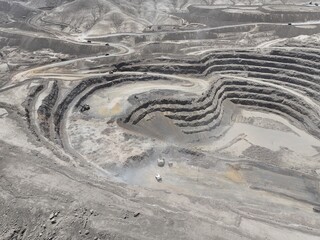 Electric Mining Shovel in Full Operation Loading Trucks at an Open-Pit Copper Mine in Chile - Heavy Machinery for Large-Scale Mineral Extraction